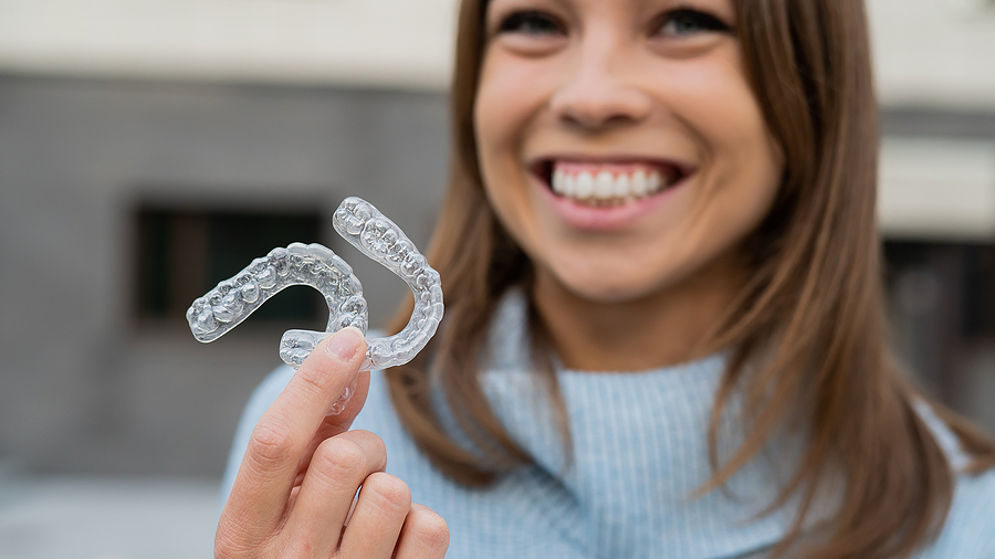 Caucasian Woman With White Smile Holding Transparent Removable R