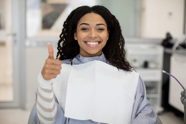 Smiling Black Female Patient Smiling And Showing Thumb Up After