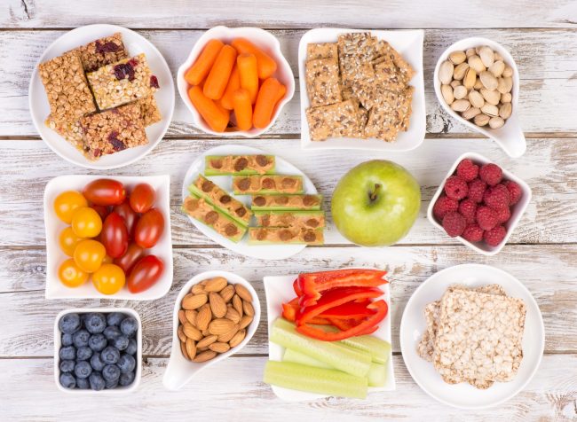 Healthy snacks on wooden table, top view How Diet Affects Your Oral Health Best Dentist in NW Calgary