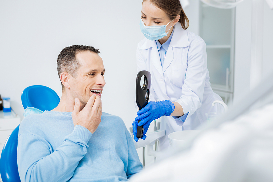 A patient wearing traditional braces at Spy Hill Dental Clinic. A patient wearing traditional braces at Spy Hill Dental Clinic.